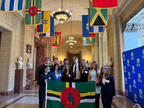 Students holding the Dominica flag