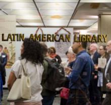 Crowd of people at conference in Latin American Library