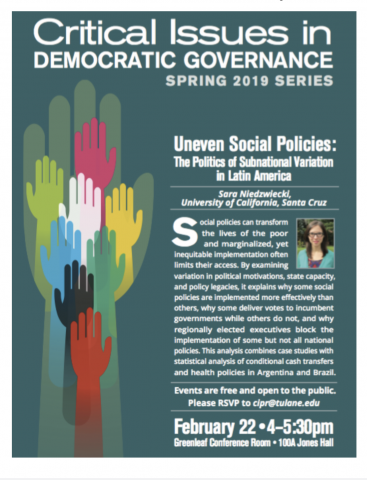 Blue-green poster for critical issues in Democratic Governance Spring Series 2019. There is a pale green hand with many different colored hands raised together. There is a small picture of Dr. Niedwiecki wearing a blue cardigan and glasses. 